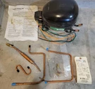 WR87X10099 Fridge Oem Compressor Kit Genuine Original New Box R134A. Fixed Price $380.00.