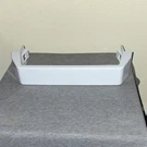 White Plastic Refrigerator Door Bin Replacement Part 2309718. Fixed Price $24.78.