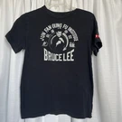 Under Armour Boys Black T-shirt With Bruce Lee Jun Fan Gung Loose Heat Gear Ylg. Fixed Price $10.94.